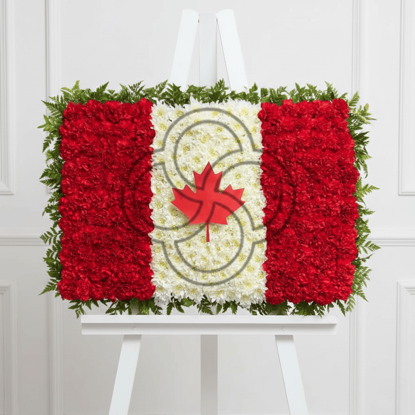 Canadian flag floral arrangement on a thick white easel with wainscoting background